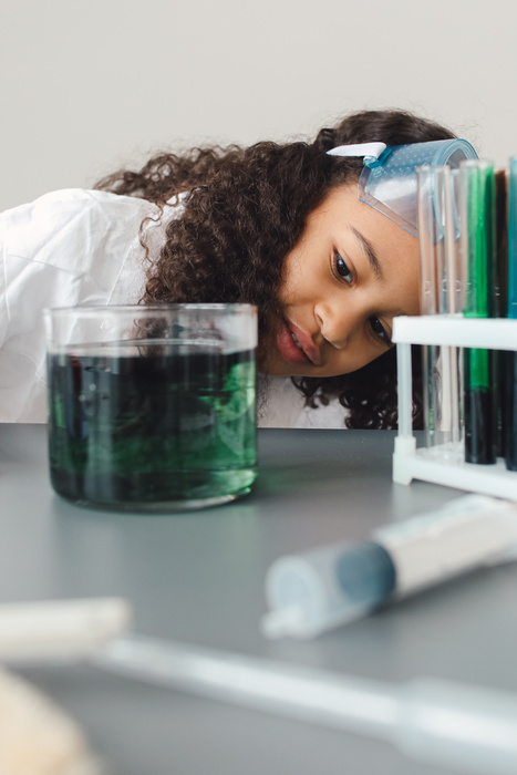 Girl Doing Science Experiment with Dyes